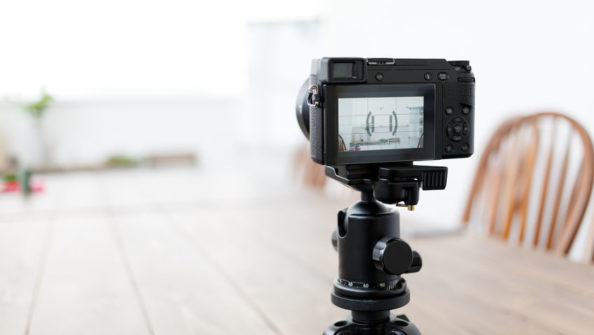 Image of camera in room with table Image of camera in room with table and chairs during day